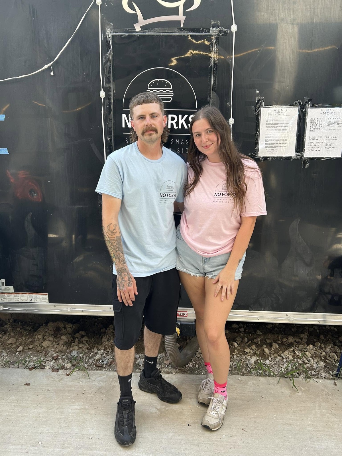 No Forks owners standing in front of their food trailer